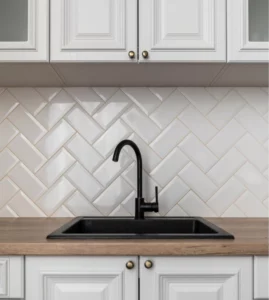 white-backsplash-tiles-in-modern-kitchen-with-a-black-faucet